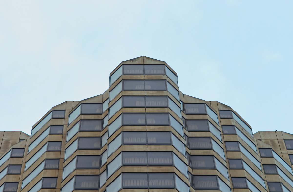 office building brown and beige curtain building during daytime condo